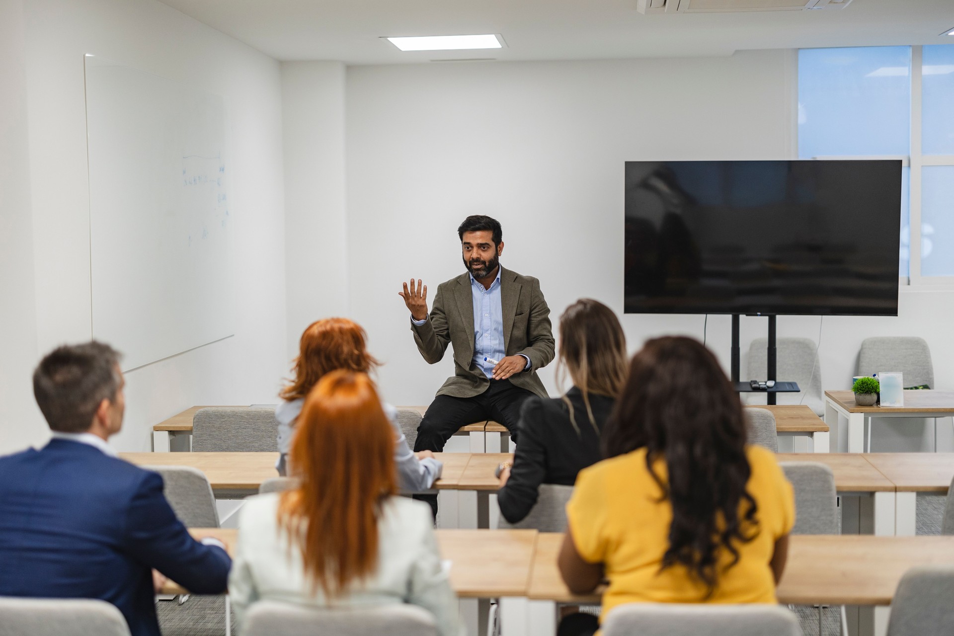 Business Professional Leading a Workshop Presentation for Multiracial Team